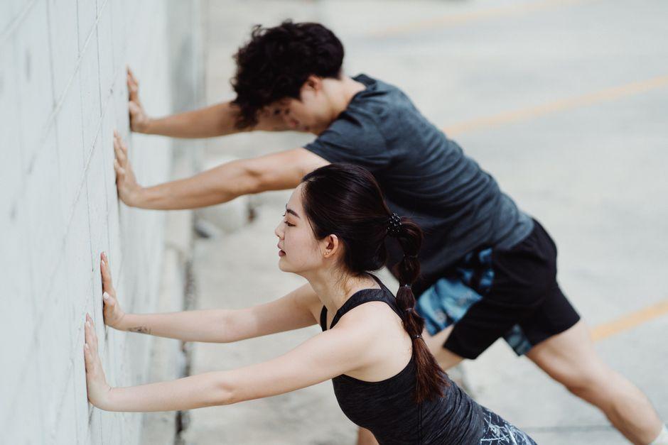 A Man and a Woman Stretching